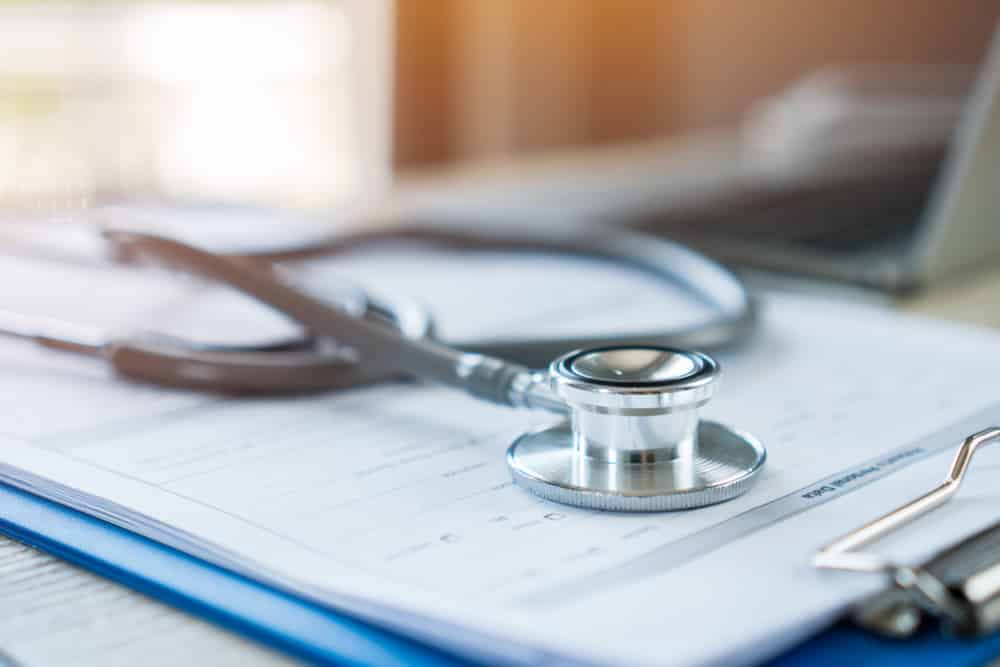 Stethoscope,On,Prescription,Clipboard,Record,On,Hospital,Office,With,Laptop cdi